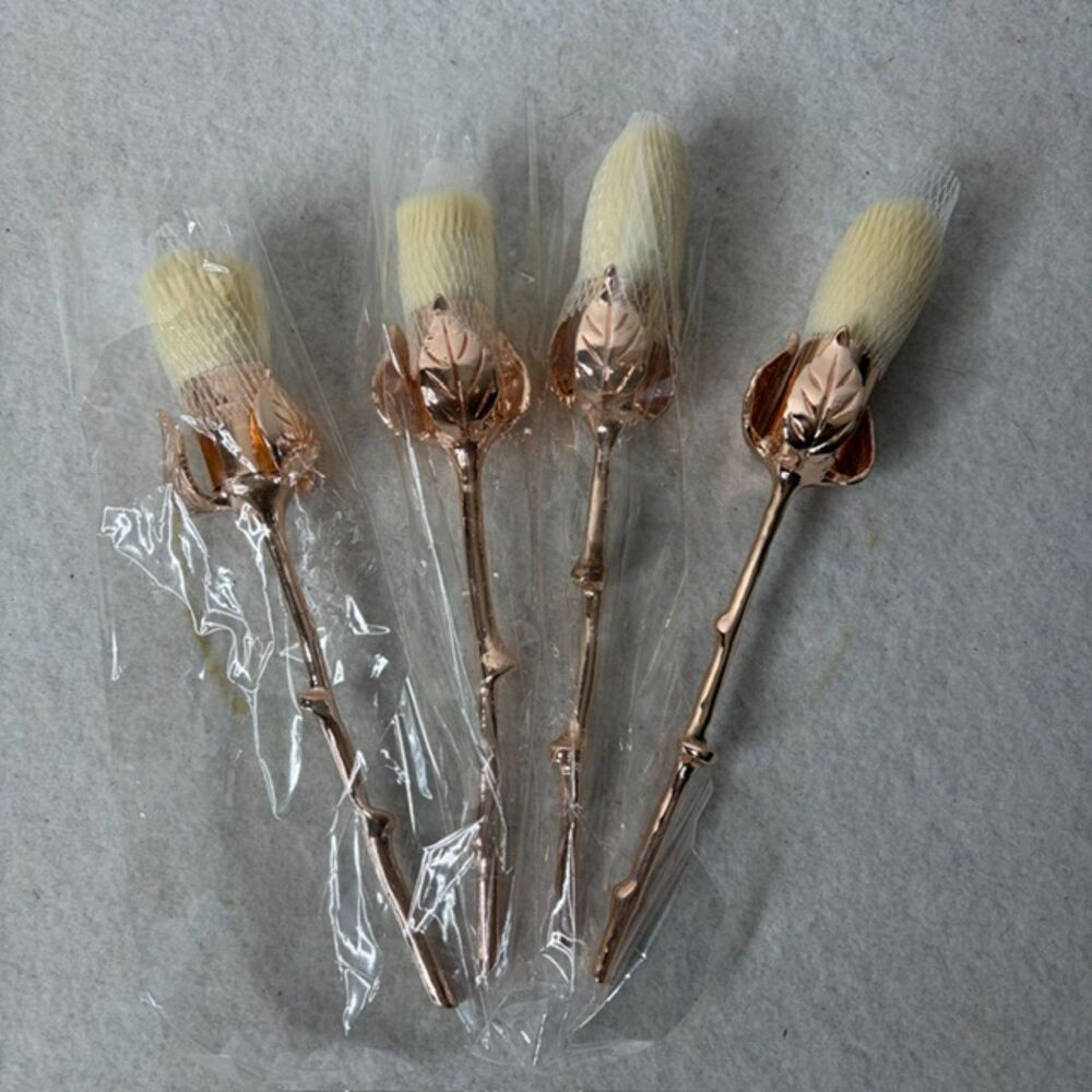 Rose gold floral makeup brush set with elegant rose handles